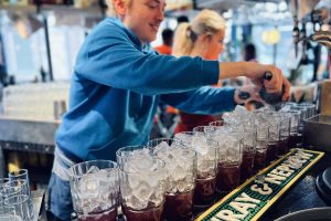 Coventry bartender adding ice to Bottomless Brunch cocktails